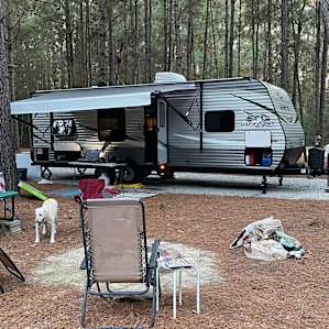 Set up and campsite number eight which is a pull through big enough for the longest rig. A great little green space behind me and then nice Pine Forest