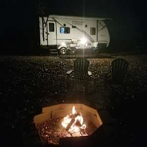 View of camper from fire pit.