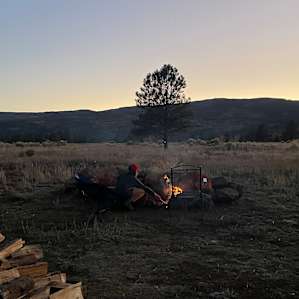My son helping with the fire after sunset. (Spot 5)