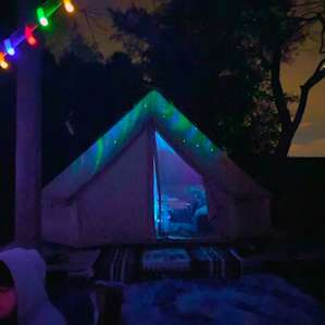Our Yurt at night with the northern lights projector inside - SO Cool!