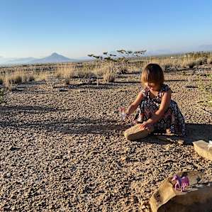 View of my youngest playing, at the lower level of the campsite, where we’d pitched our tent.