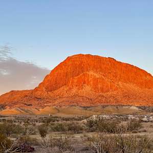 backdrop of the campsite at sunset.