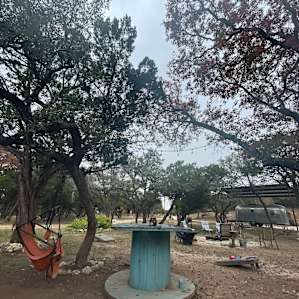 Common area. Corn hole, swings, fire pit, kitchen, flushing toilets, and chickens!!