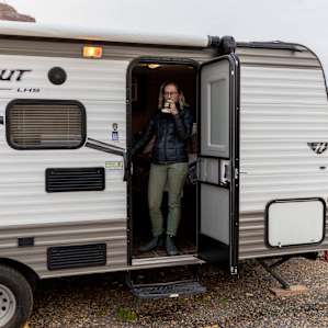 Hipcamper enjoying the view and drinking coffee from the stay.