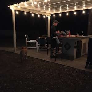 Lovely, well lit, and charming patio/grill area for cooking and relaxing.