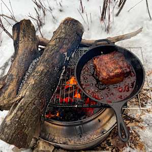 Bring your cast iron, and your chef. You can’t beat a meal cooked over a fire.