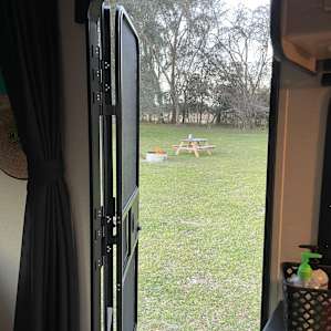 Nice flat grass area for campers/tents. Fire ring/Picnic Table/power access