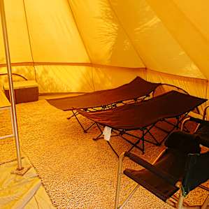Right side - Two Cots and Chairs (we fit 2 full sized pads on the floor)