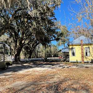 The rv spots are parallel to the house.