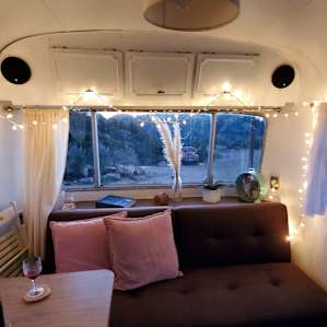 Perfect little corner of the camper to chill, listen to music and read with a glass of fine Temecula wine 🍷