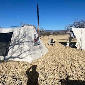 Enjoying this amazing place in our canvas tent with a wood stove.