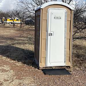 This was a very clean port-potty down in the trees..