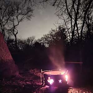 The firepit had kindling in it and the picnic table was big, it was really welcoming.