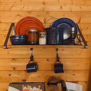 The cabin had plates, mugs, coffee and many other things you might need.