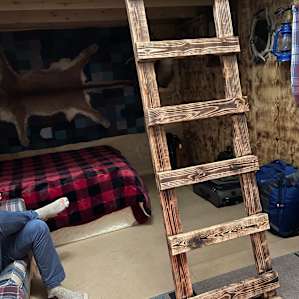 Ladder up to loft that also has a comfy bed for sleeping space.