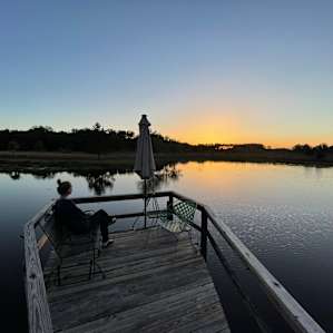 Watching the sunset from the dock over the pond.