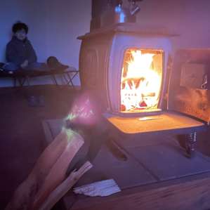 Heating the Hogan for the night. We were comfortable all night.
