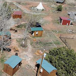 The bunkhouses, with fire pits, picnic tables, outdoor kitchen area, and nearby showers, were near the south end, the teepee and larger cabin were up north a bit.