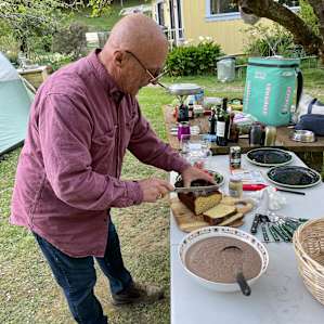 John slicing the bread he made.