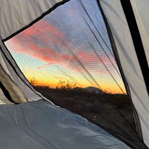 Desert Camping with Turbine Views