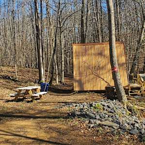 Higlights: the outhouse, seating options, and secluded woodsy setting✌️