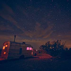 Lighting Golden Dawn bus under a beautiful New Mexican night sky