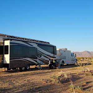 Flat desert with mountain views.