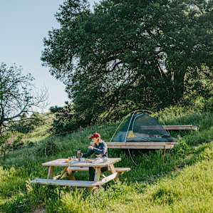The lower tent pad and picnic table!