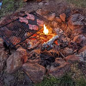 Cooking Dan's lamb chops on the open fire