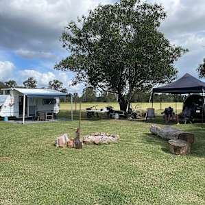 Our camp plenty of space.. lovely mowed grass. Campfire area large. Wood bundle in extras is great!