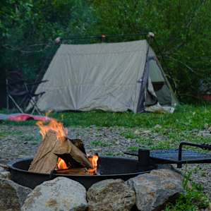 cast iron metal fire pit helps extend the camp fire season