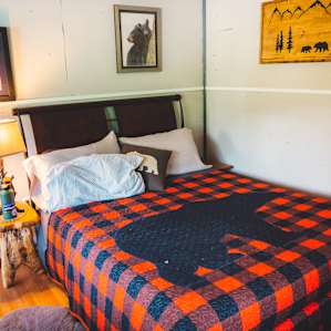 The bed, featuring a quilt hand made by the host.
