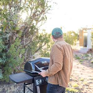 Preparing the grill for the evening.