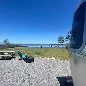 Great lawn, bbq, chairs for hanging out, see dock and kayaks down near water’s edge