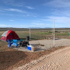 Camp site 4 setup. Host has ordered cover for shade. Plenty of room to spread out more or set up camp differently.