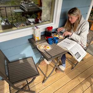 Breakfast reading some of the books from the cabin!