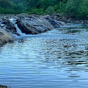 Beautiful waterfall and swimming across the highway.