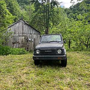 The small cabin at the campsite and Bills Suzuki Samurai.