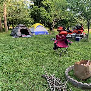 Layout - drive straight down lane. Owners house on left. Keep driving straight along the field fence line. Camping is into the mowed wooded area and has nice shade with a cool breeze coming from across the field.