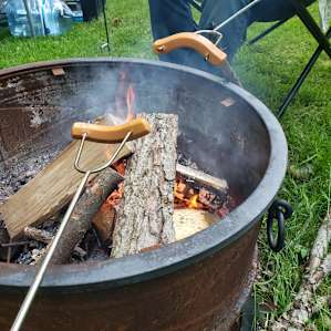Hot dogs over the fire ring!