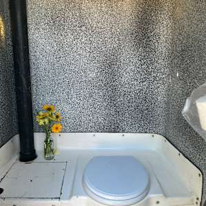 Toilet even has flowers inside