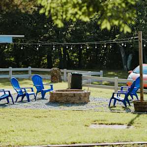 The commons area next to parking, in front of the cabin.