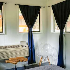 Black out curtains come in handy when the tiny cabin village lights up at night.