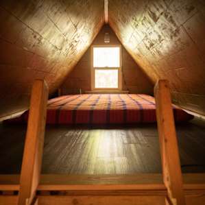 The loft in the top part of the cabin - very cozy with a view to outside.