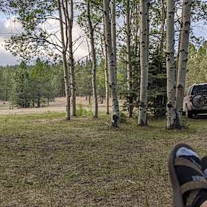 chilling at the campsite after riding all day at Angel Fire Bike Park. This is the view from the campsite out toward the parking and road to site.