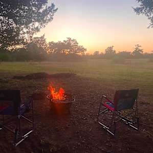 Sun setting June 25 fire pit is great the grill grate was an awesome amenity
