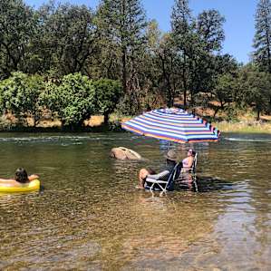 Great place to relax and watch the rafters. The water levels change. There is plenty of room on the rock beach for chairs and/or beach blankets or you can put chairs in shallow water.