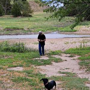 Sandy area. Low point in the river where people could cross over. I saw some wild turkeys across the river. Deer prints appeared overnight where they had come to drink.