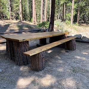 Homemade picnic table on the spacious campsite