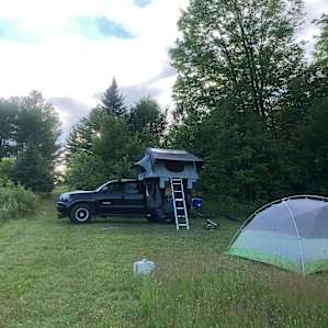 Each site had a well kept mowed area that was generous in size. You can see the water that was left for us. I used Gotreads to level my truck as I would at many camping spots. My buddy found a nice level spot for his 4 person ground tent.